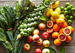a group of fruits and vegetables on a wood surface Healthy Weight Loss Diets Healey